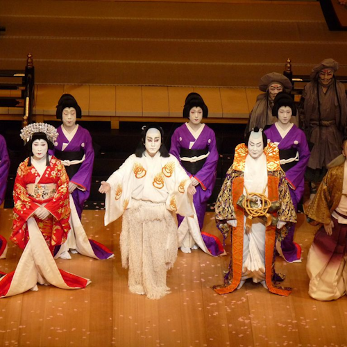 A captivating ensemble of theater artists, adorned in exquisite traditional Japanese attire, captivatingly performing a mesmerizing show. A captivating ensemble of theater artists, adorned in exquisite traditional Japanese attire, captivatingly performing a mesmerizing show.