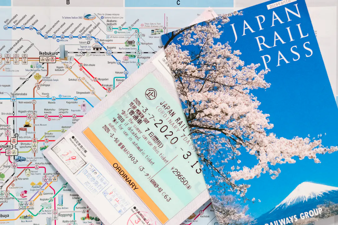 Two Japan rail pass (JR Pass) over a Tokyo subway map