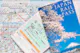 Two Japan rail pass (JR Pass) over a Tokyo subway map