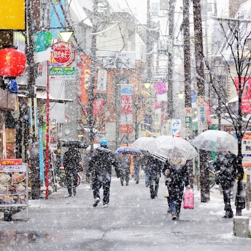 Atmosphere of people walking to work during cold and snowy time, Tokyo, Japan. Tokyo in Winter