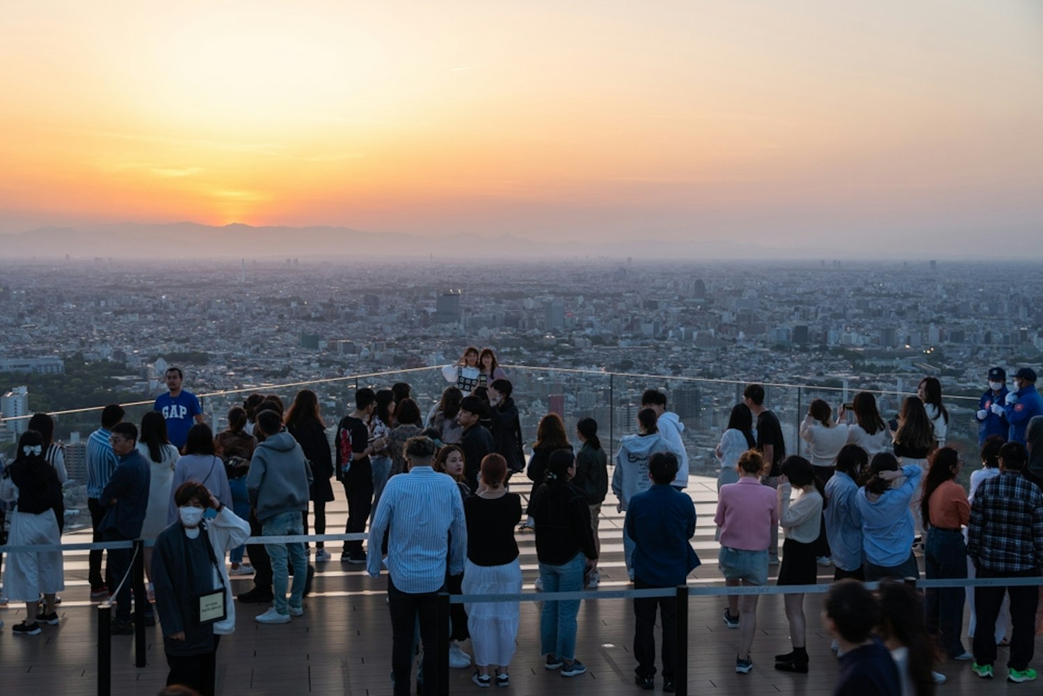 People Watching Sunset Over Tokyo from Shibuya Sky