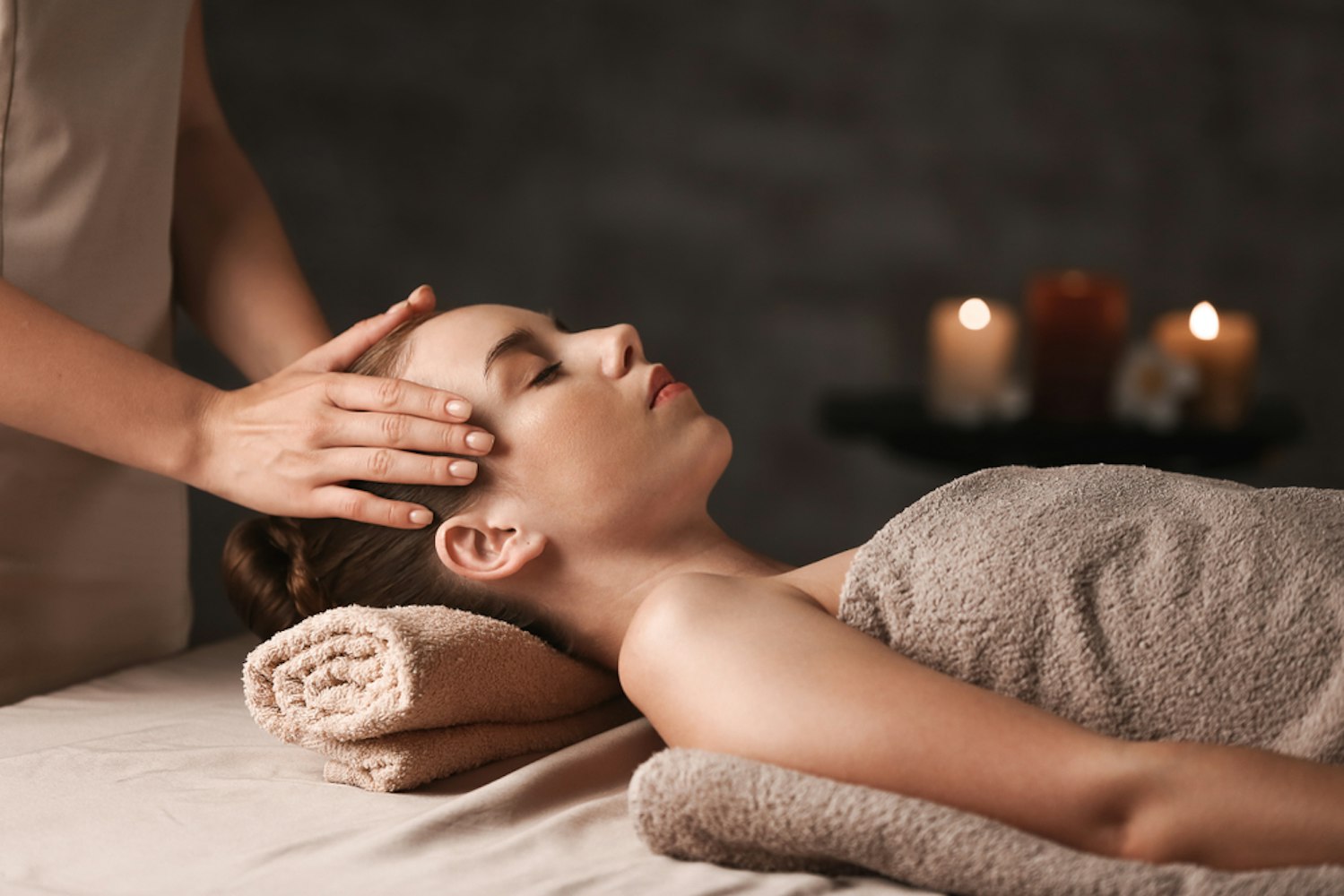 Young woman having massage in spa salon