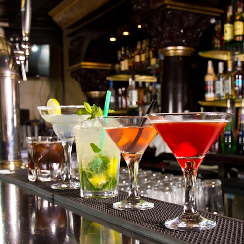 Five cocktails on the bar counter