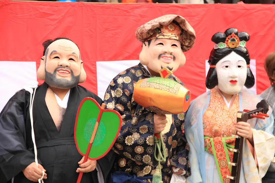 Setsubun Festival Three people in traditional masks and costume at a Setsubun festival