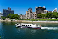 Atomic Bomb Dome with passenger boat at Hiroshima Peace Memorial Park at daytime