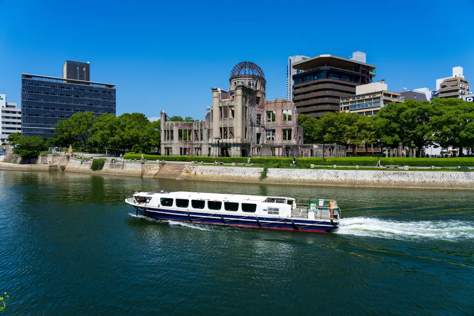 Atomic Bomb Dome with passenger boat at Hiroshima Peace Memorial Park at daytime