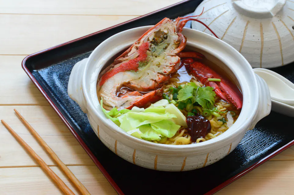 Nabeyaki ramen is boiled thin noodles served in a chicken stock and soy sauce soup Nabeyaki ramen is boiled thin noodles served in a chicken stock and soy sauce soup