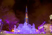 Snow sculpture of palace with Sapporo TV tower background in Sapporo Snow Festival
