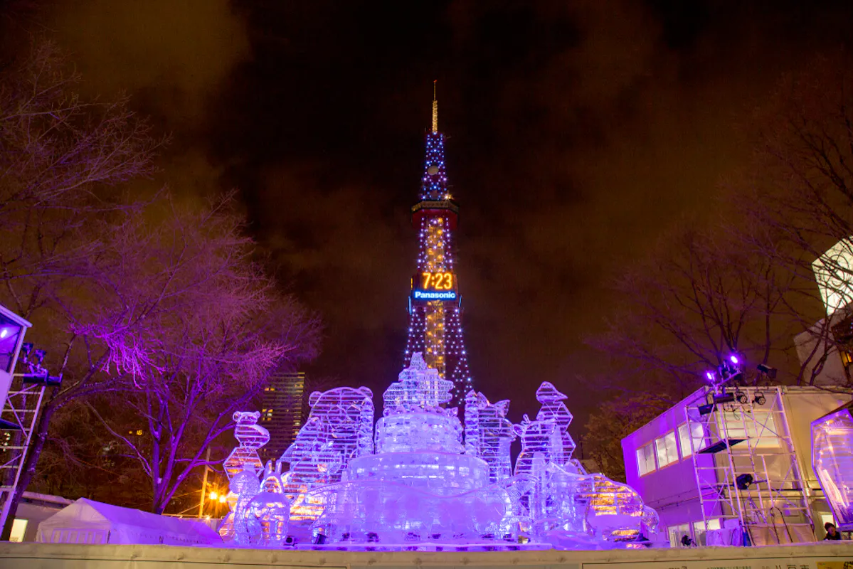 Snow sculpture of palace with Sapporo TV tower background in Sapporo Snow Festival