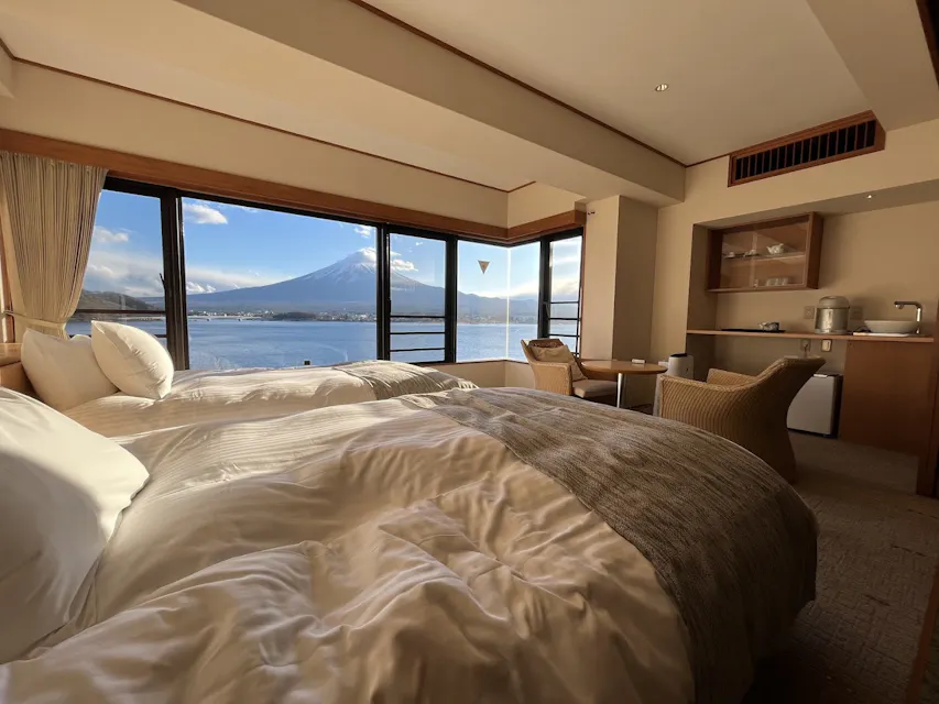 A cozy hotel room with a view of  mount Fuji