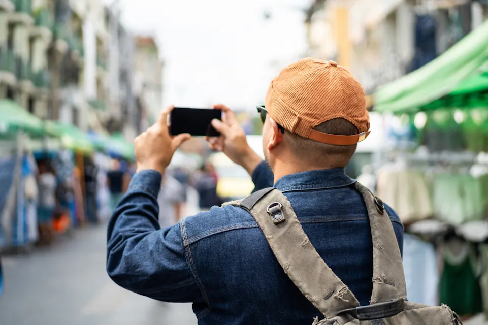 Happy tourist walking in the  traditional market
