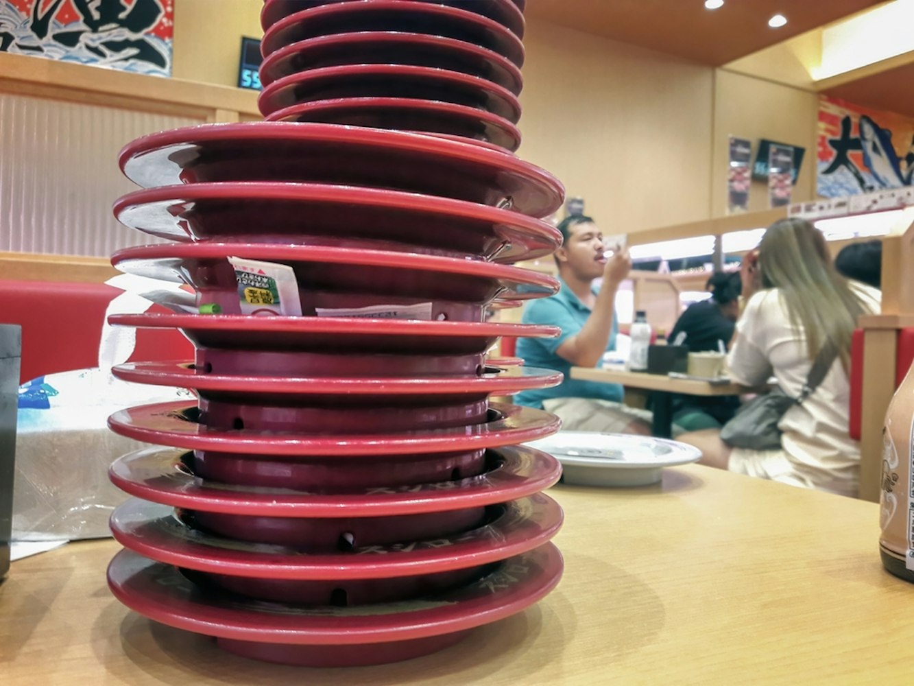 Stacks of plates at a sushi conveyor belt restaurant