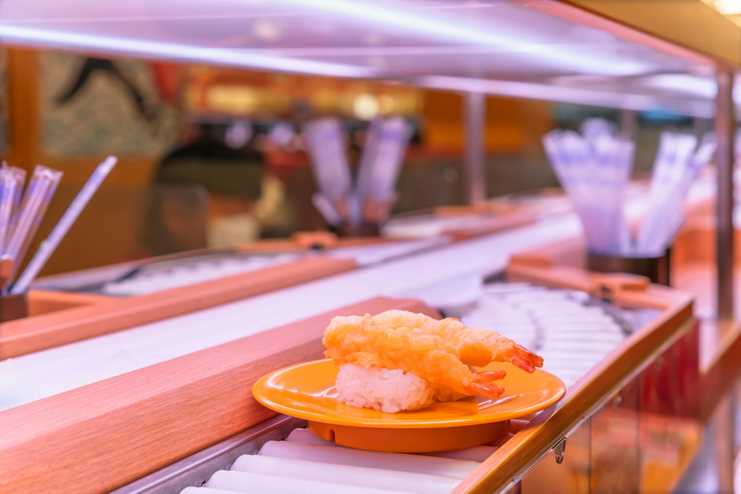 Close up on a plate carrying two pieces of tempura shrimps sushi