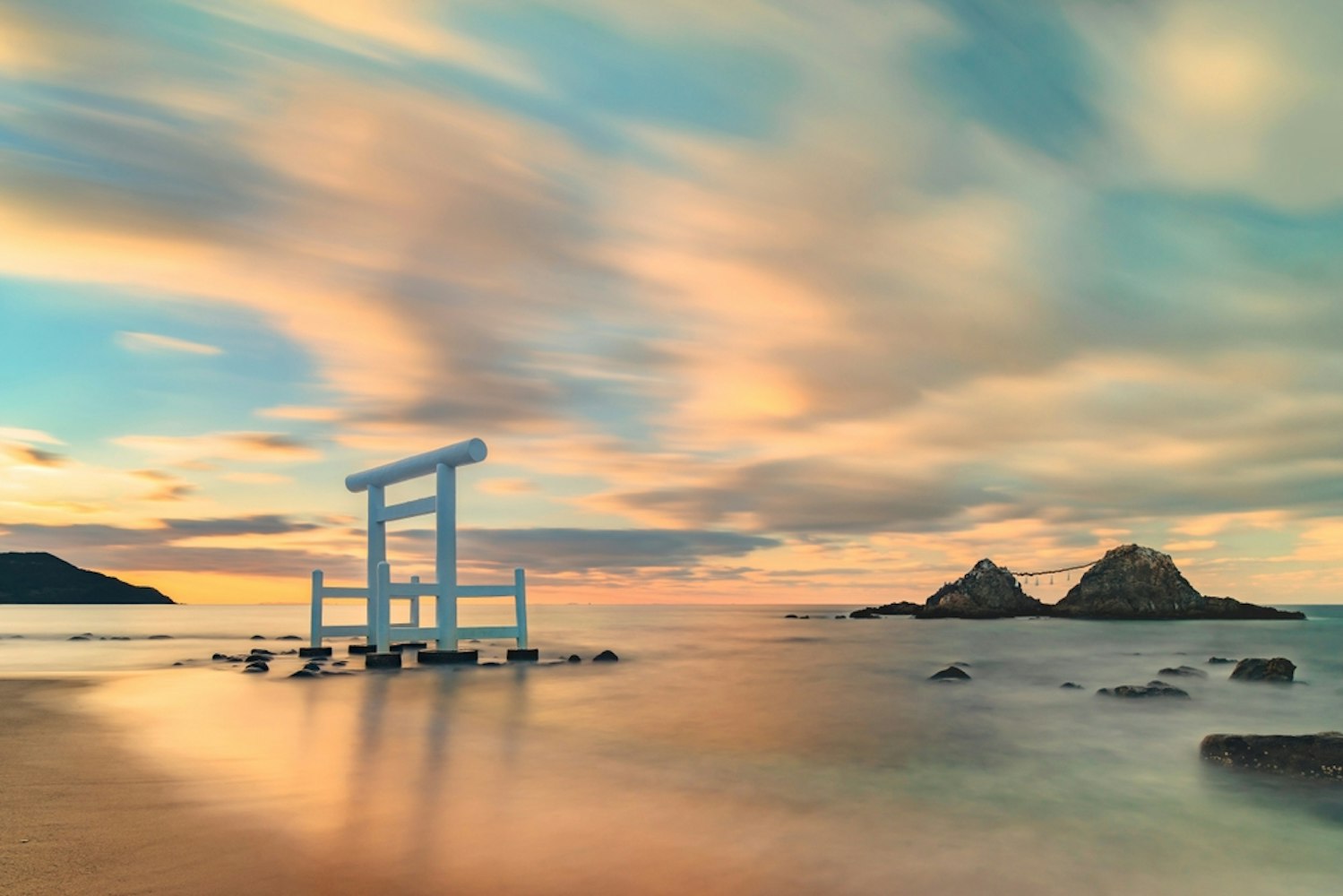 Itoshima Beach of Fukuoka famous for its white Shinto torii gate in front of the Couple Rocks called Sakurai Futamigaura's Meoto Iwa