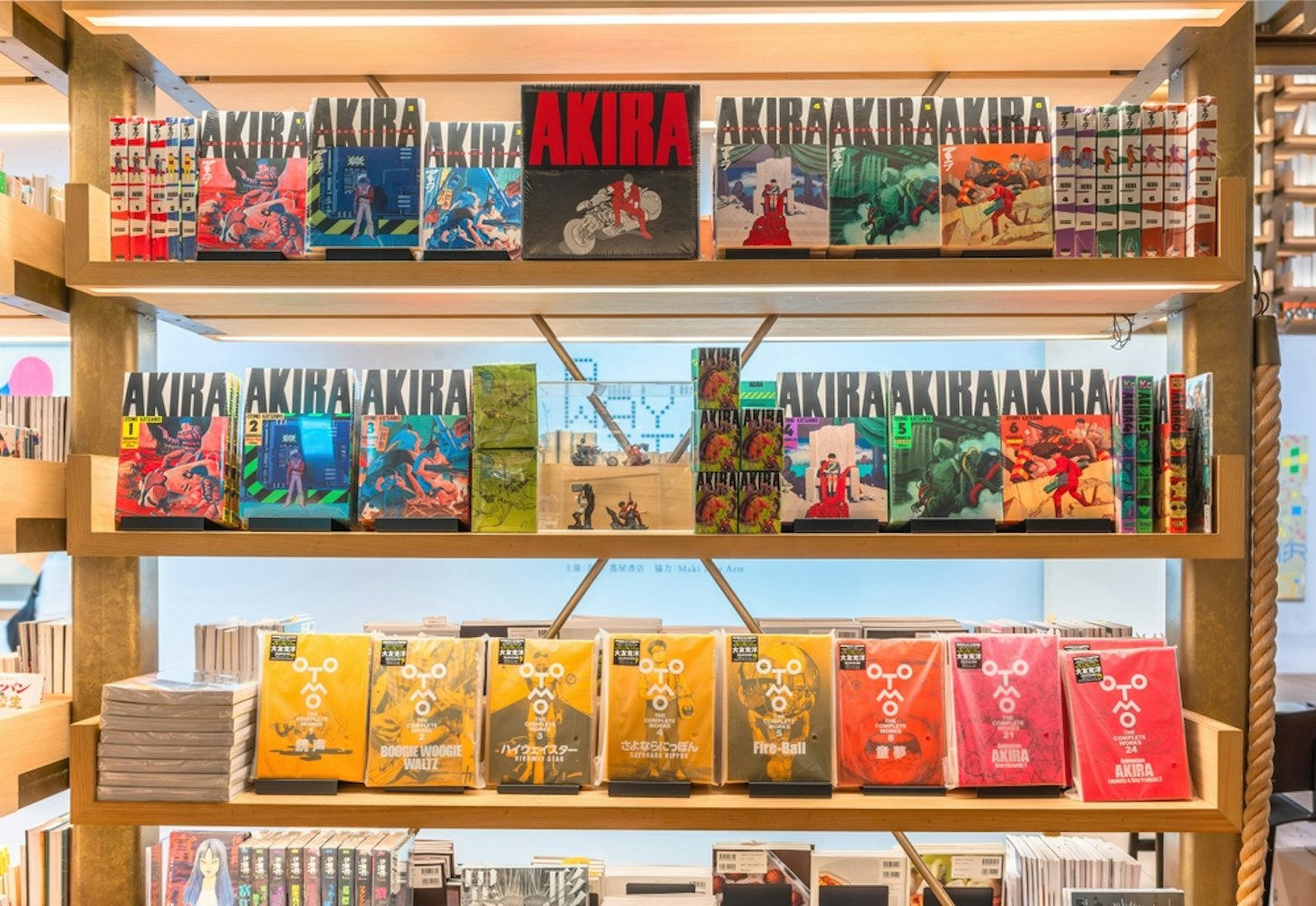 Display of Katsuhiro Otomo’s iconic manga Akira fills a bookshelf with other artworks