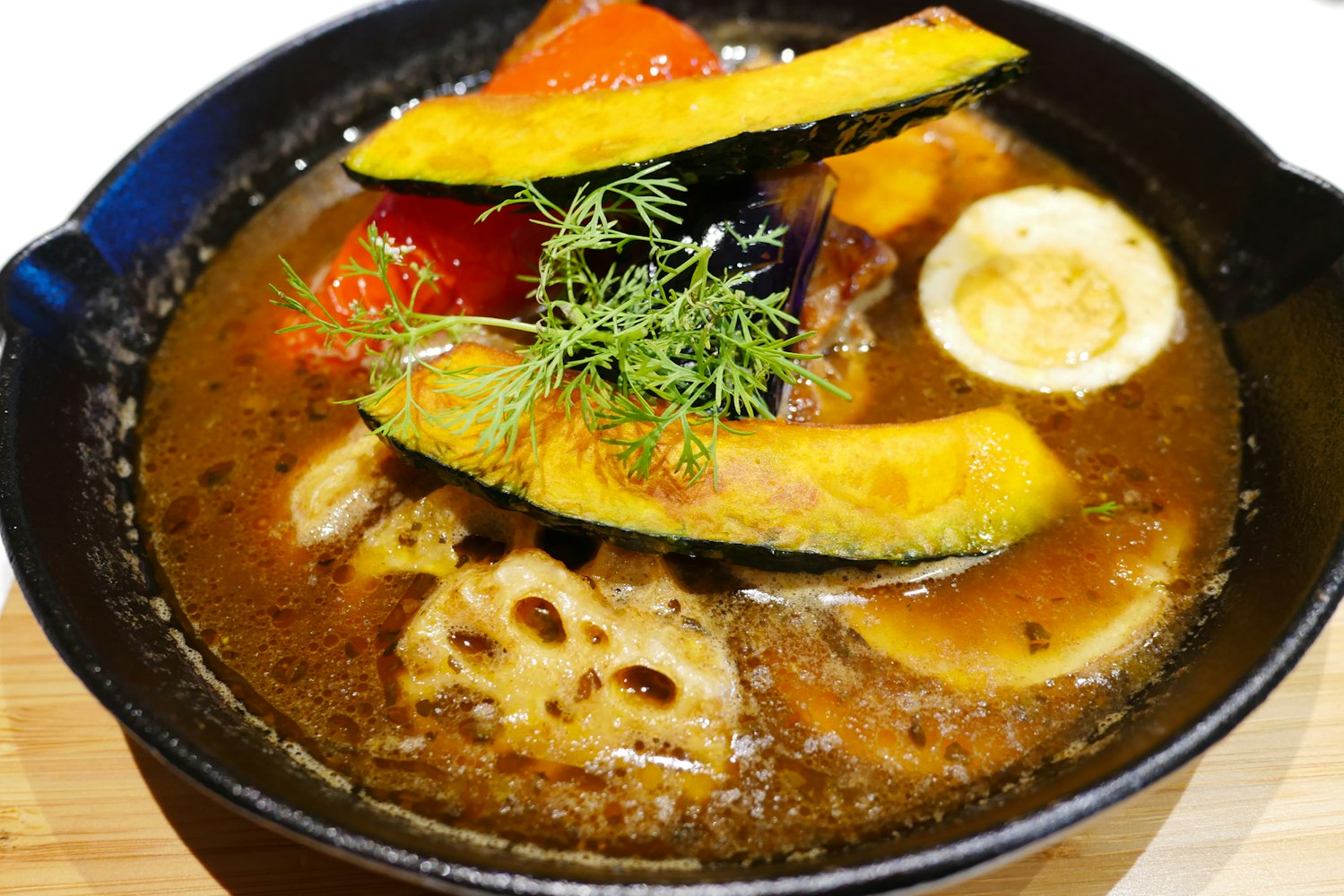 Hokkaido soup curry with chicken and vegetable Hokkaido soup curry with chicken and vegetable