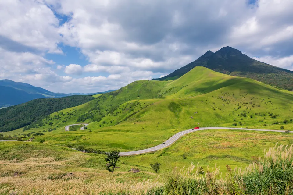 Top view of cars on silky road by Mount Yufu, Yufuin, Oita, Japan