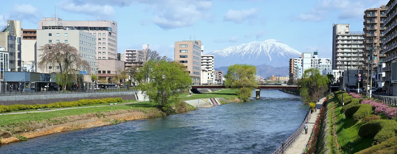 Panoramic of Iwate mountain and Morioka city and riverside walkway at Kitakami river in Morioka