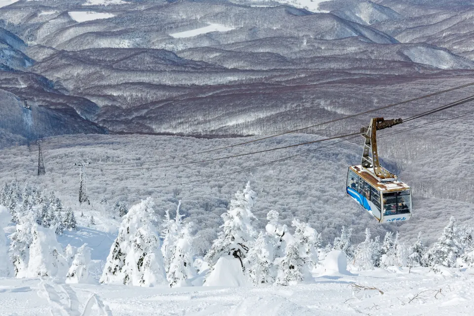 Tourists ride on a cable car to the top of Mount Hakkoda Tourists ride on a cable car to the top of Mount Hakkoda