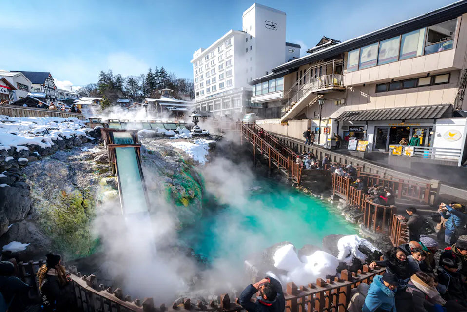 People visit the Yubatake hotspring at Kusatsu Onsen of Kusatsu City in the Winter