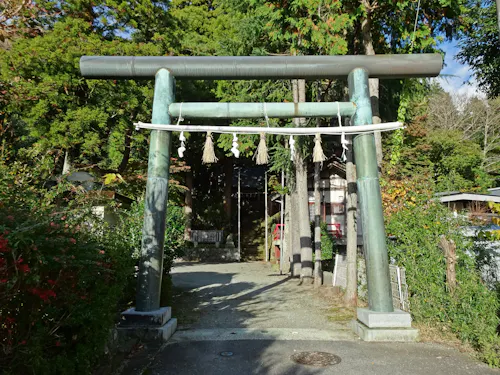 Stone torii gate and shrine approach at Suwa Shrine in Sengokuhara, Hakone.