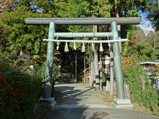 Stone torii gate and shrine approach at Suwa Shrine in Sengokuhara, Hakone.