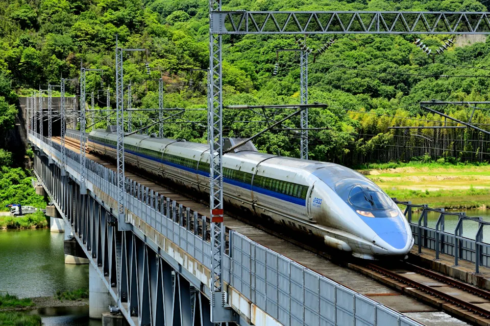 A 500 series Shinkansen train traveling on the Sanyo Shinkansen Takahashi River Bridge A 500 series Shinkansen train traveling on the Sanyo Shinkansen Takahashi River Bridge