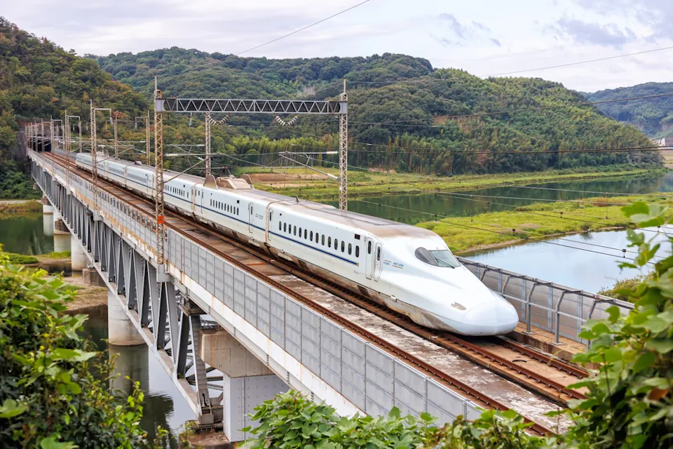 Shinkansen N700 high-speed train operated by Japan Rail JR West on Sanyo Shinkansen line in Kurashiki Shinkansen N700 high-speed train operated by Japan Rail JR West on Sanyo Shinkansen line in Kurashiki