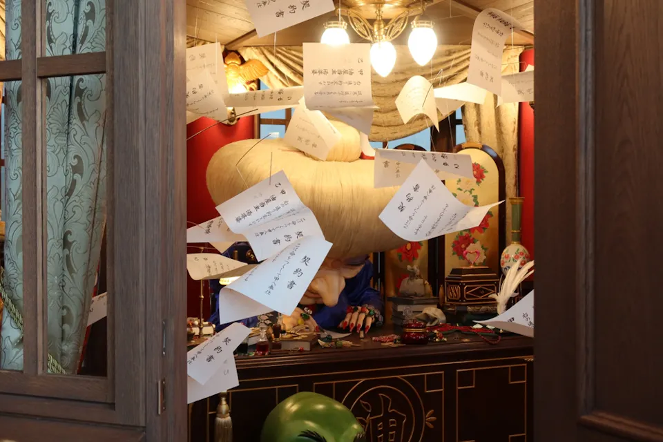Display from Ghibli Park’s Valley of Witches area with giant masks and flying papers Display from Ghibli Park’s Valley of Witches area with giant masks and flying papers