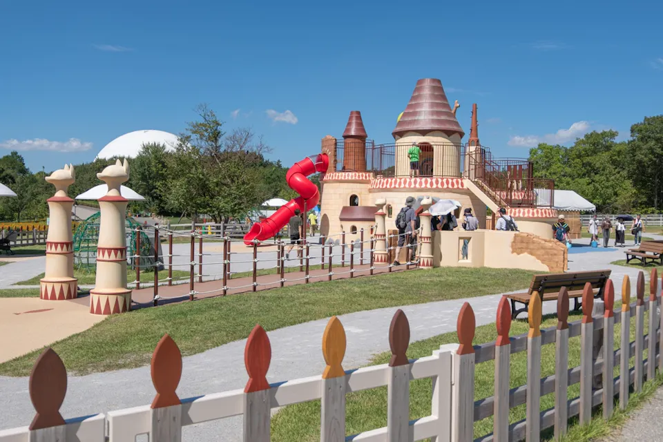 Children playing on castle-themed playground Children playing on castle-themed playground