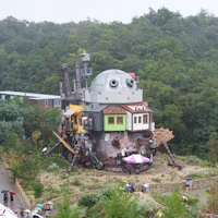 A large-scale replica of Howl's Moving Castle in the Valley of Witches area at Ghibli Park A large-scale replica of Howl's Moving Castle in the Valley of Witches area at Ghibli Park