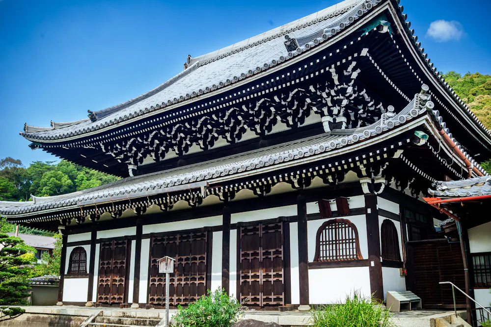 The main hall of Koun-ji, a Zen temple near Nanzen-ji. Main hall of Koun-ji Zen temple in Kyoto with a tiled roof and wooden doors