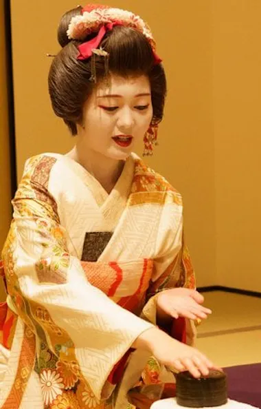 Playing Konpira fune fune with a geisha. Geisha playing the Konpira fune fune parlor game with a guest in Asakusa
