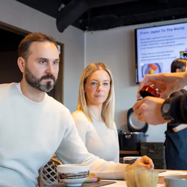 Hot water served to each guest. Instructor serving hot water to a private party