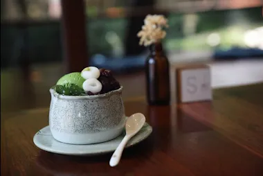 Matcha dessert with sweet dumplings on a wooden table