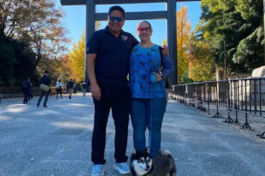 Couple standing on the approach to Yasukuni Shrine with Ginta