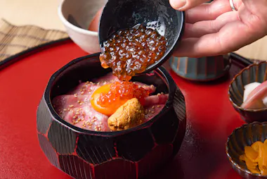 Salmon roe spooned over a roast beef rice bowl