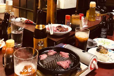 Yakiniku beef grilling on a tabletop burner
