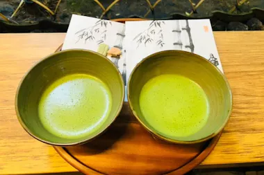 Two bowls of frothy matcha on a tray at the Hokoku-ji teahouse