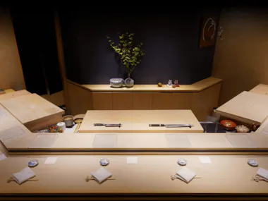 Empty omakase sushi counter set for diners