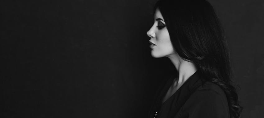 Black and white image of the side profile of a woman