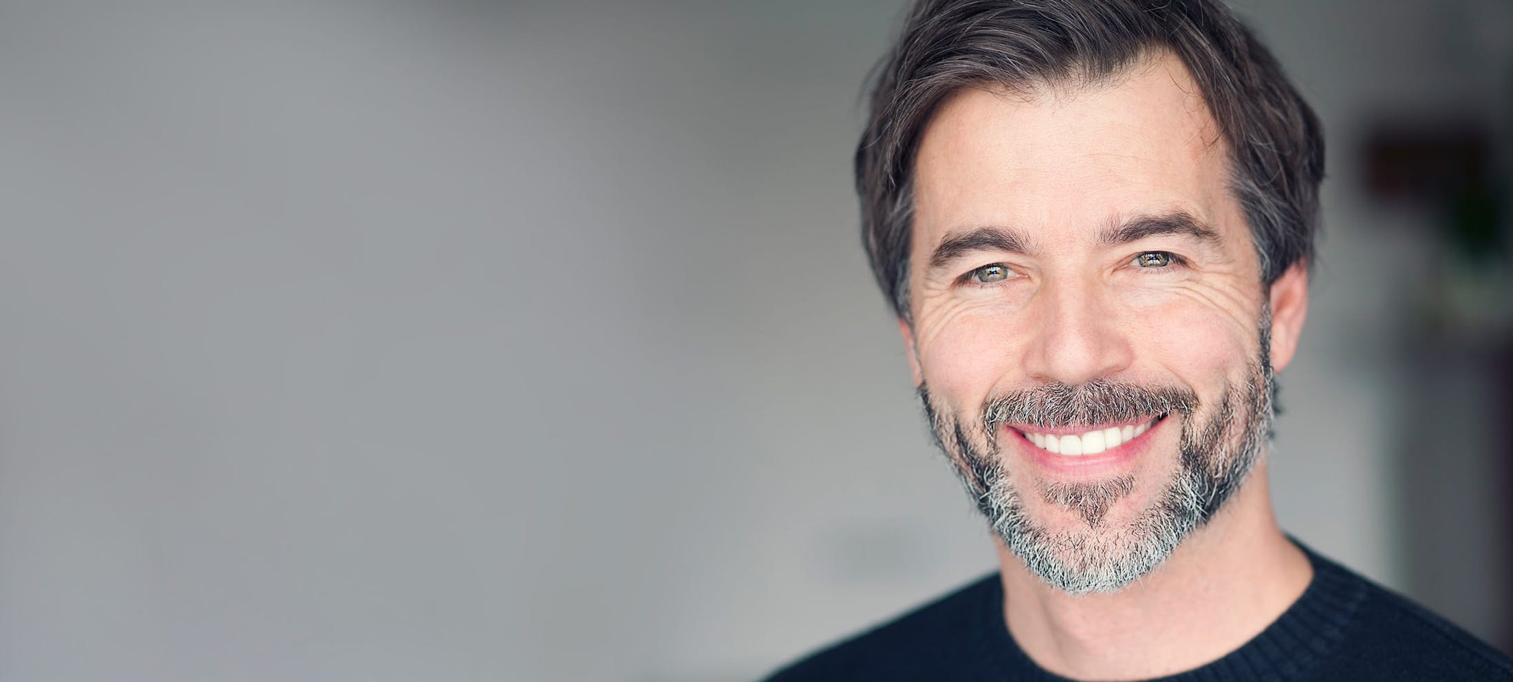 Handsome man with salt and pepper facial hair