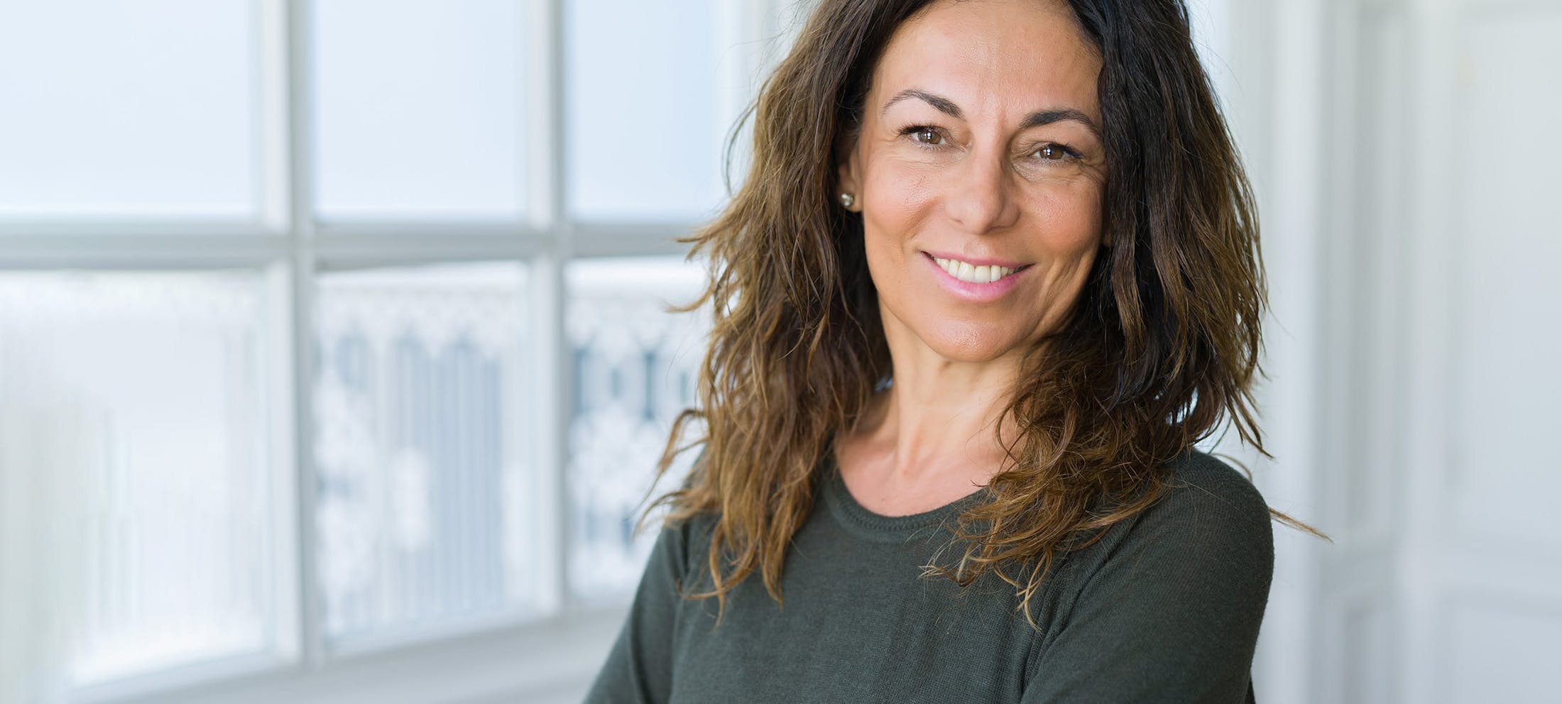 Woman with brown hair smiling