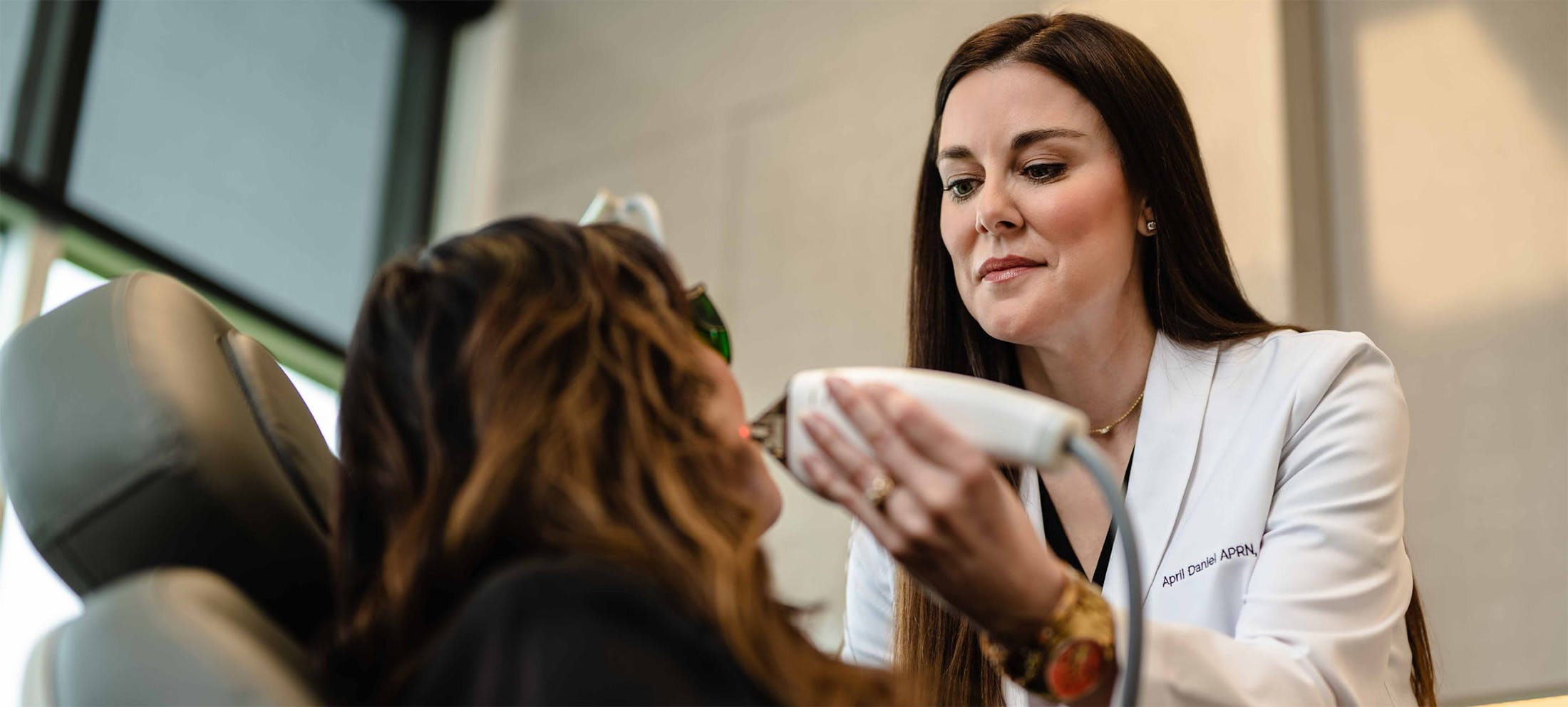Staff at The Piazza Center performing a face treatment