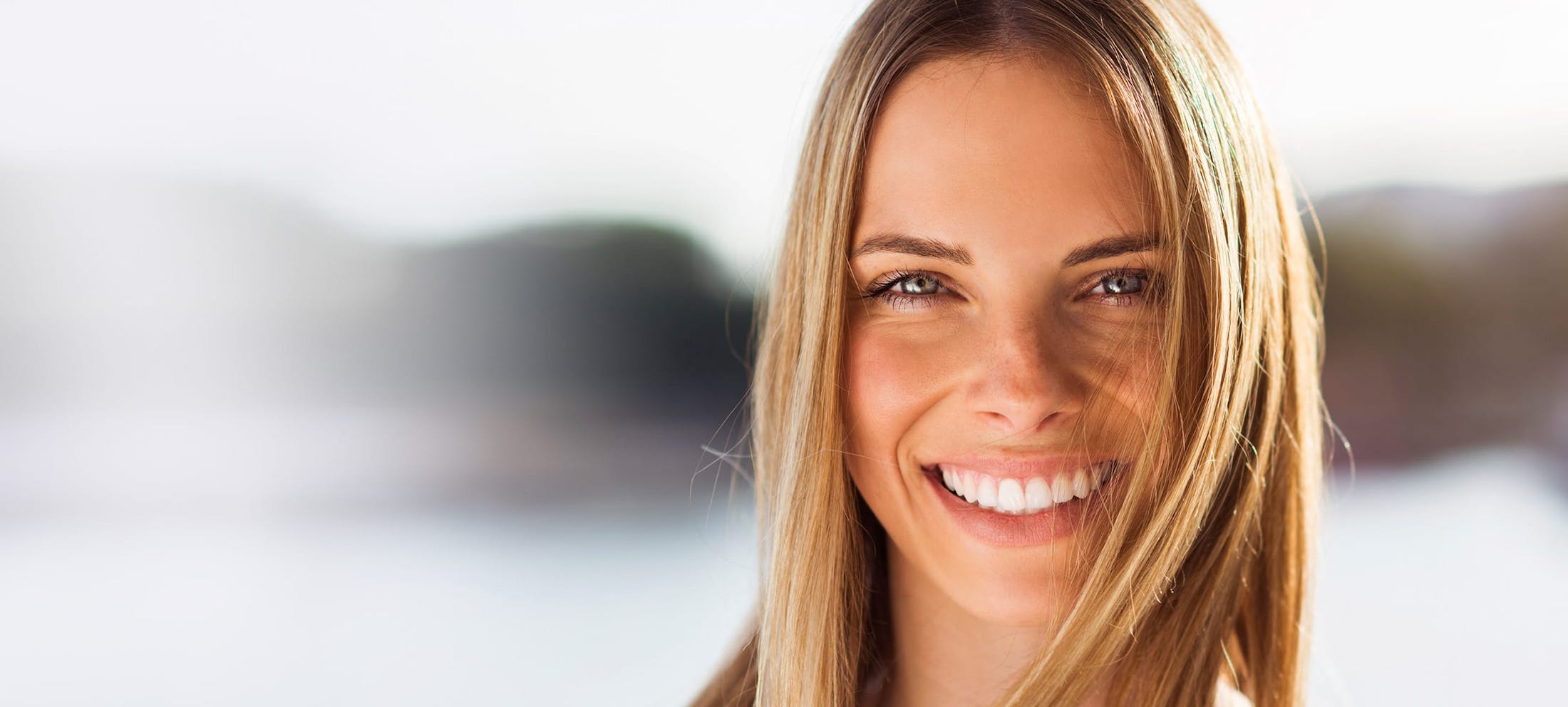 Woman with long blonde hair smiling