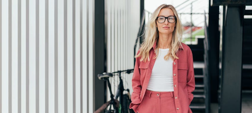 Woman in a pink jacket and pants