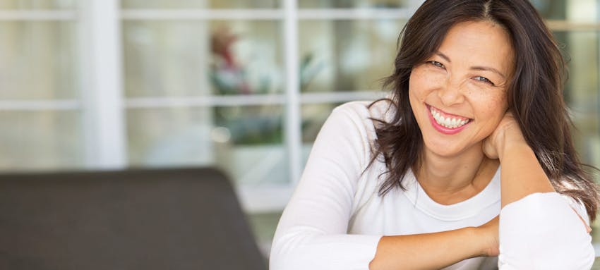 Woman in a white shirt smiling