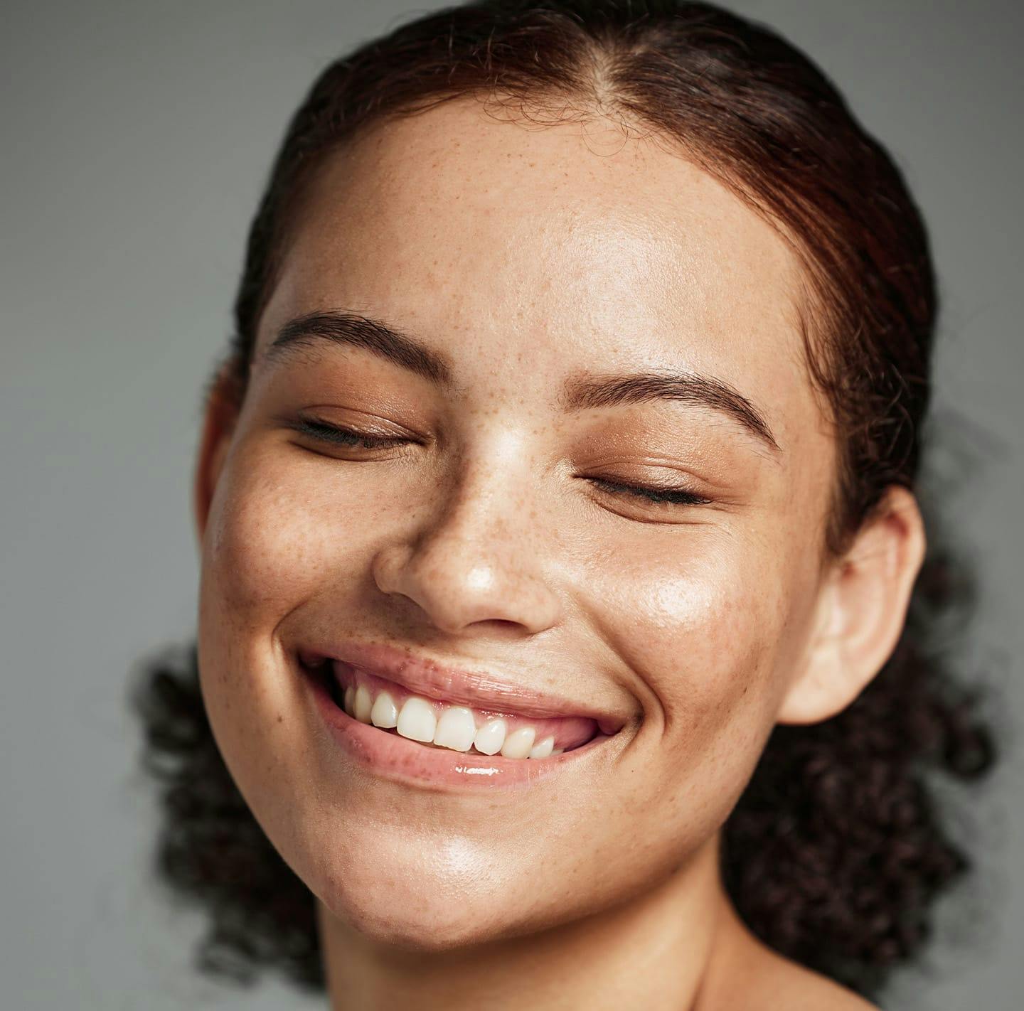 Woman with freckles smiling
