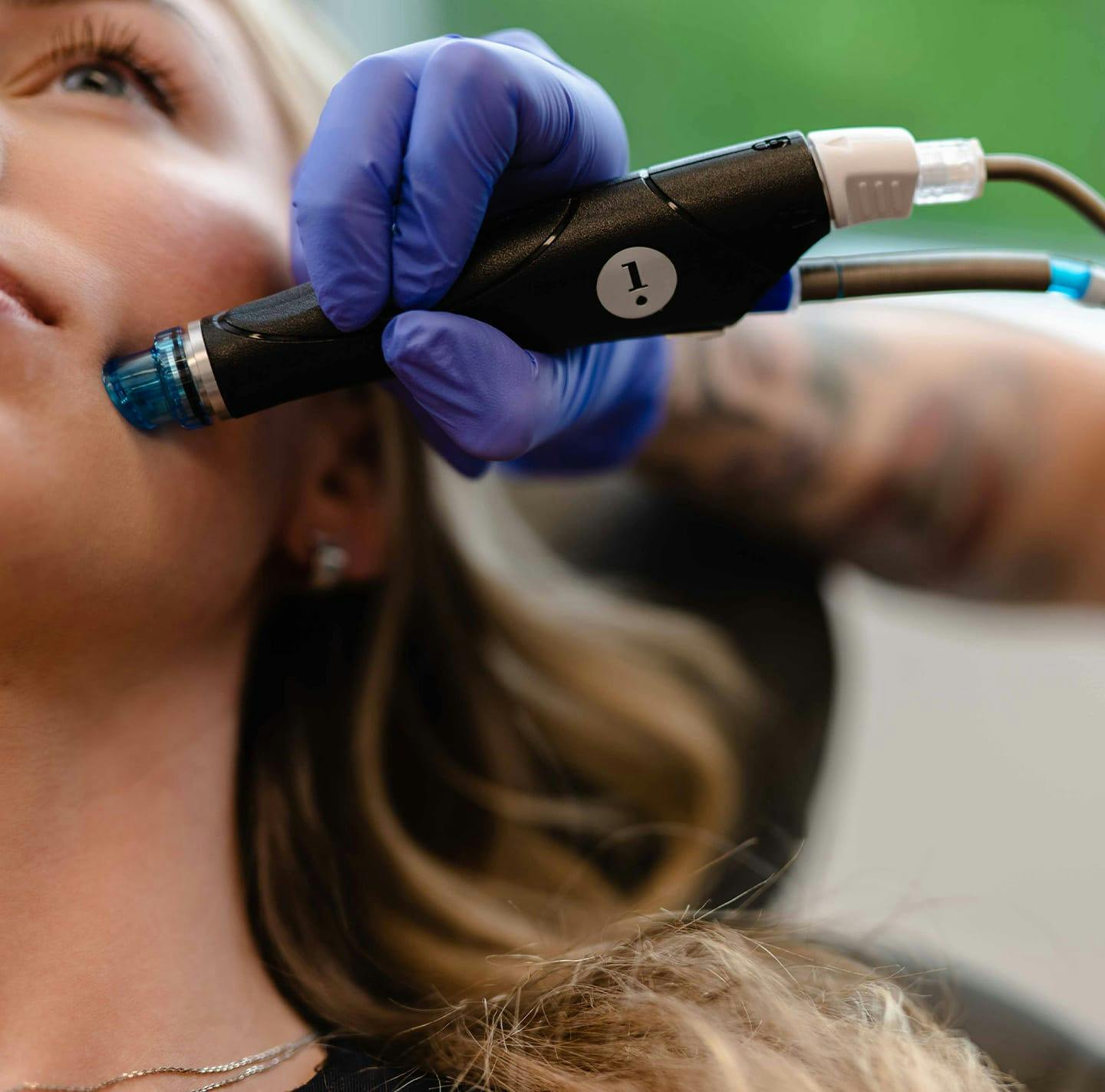 Female patient receiving a HydraFacial treatment at The Piazza Center in Austin