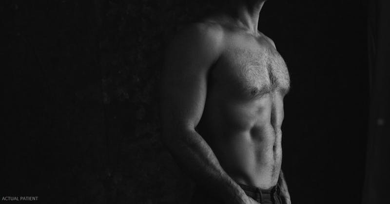 a close up of a man shirtless